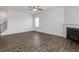 Cozy living room with modern flooring, a fireplace, and staircase to the upper level at 167 Young Farm Dr, Lillington, NC 27546