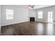 Spacious living room featuring modern flooring, a fireplace, and abundant natural light at 167 Young Farm Dr, Lillington, NC 27546