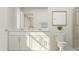 Well-lit bathroom featuring a double vanity, modern fixtures, and clean lines for a spa-like experience at 172 Paramount Dr, Smithfield, NC 27577