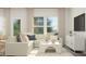 Comfortable living room with sectional sofa, decorative pillows, and ample natural light at 172 Paramount Dr, Smithfield, NC 27577