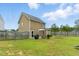 Spacious backyard featuring a wood fence, well-manicured lawn, and a patio at 19 Kimberly Ct, Lillington, NC 27546