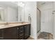 Bathroom with double sinks, granite countertops, and shower with glass door at 19 Kimberly Ct, Lillington, NC 27546