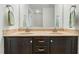 Bathroom featuring dual sink vanity with granite countertop and modern faucets at 19 Kimberly Ct, Lillington, NC 27546