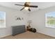 Cozy bedroom with neutral carpet, chair, and window providing natural light at 19 Kimberly Ct, Lillington, NC 27546