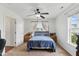 Bedroom with neutral carpet, blue bedding, and window providing natural light at 19 Kimberly Ct, Lillington, NC 27546