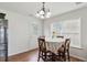 Bright dining area featuring a chandelier, backyard access, and neutral decor at 19 Kimberly Ct, Lillington, NC 27546