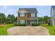 Charming two-story home with a well-manicured lawn and concrete driveway at 19 Kimberly Ct, Lillington, NC 27546