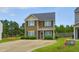 Charming two-story home with a well-manicured lawn and concrete driveway at 19 Kimberly Ct, Lillington, NC 27546