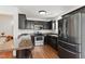 Well-equipped kitchen with stainless steel appliances and dark wood cabinets at 19 Kimberly Ct, Lillington, NC 27546