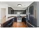 Well-equipped kitchen with stainless steel appliances and dark wood cabinets at 19 Kimberly Ct, Lillington, NC 27546