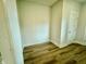 Empty walk-in closet features hardwood floors and white trim at 1915 Plott Balsam Dr, Wendell, NC 27591