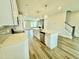 Kitchen with white cabinets, stainless appliances, and a large center island at 1915 Plott Balsam Dr, Wendell, NC 27591