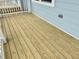 A view of the natural wood planks of the home's front porch at 1915 Plott Balsam Dr, Wendell, NC 27591