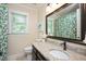Bathroom featuring granite counters, neutral walls, and large framed mirror at 2008 Corberrie Ln, Raleigh, NC 27613