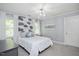 Light-filled bedroom with whimsical wallpaper, white curtains, and plush bedding at 2008 Corberrie Ln, Raleigh, NC 27613
