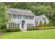 Charming two-story home with blue siding, black shutters, and manicured landscaping at 2008 Corberrie Ln, Raleigh, NC 27613