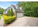 Attached two-car garage with private driveway and well-manicured landscaping at 2008 Corberrie Ln, Raleigh, NC 27613