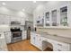 Kitchen with white cabinetry, stainless appliances and desk space at 2008 Corberrie Ln, Raleigh, NC 27613