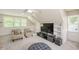 Cozy living room with built-in shelving and comfortable armchairs at 2008 Corberrie Ln, Raleigh, NC 27613