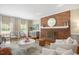 Inviting living room featuring a brick fireplace, hardwood floors, and comfortable seating at 2008 Corberrie Ln, Raleigh, NC 27613