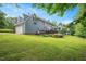 Back exterior view of the home showcases a deck and screened-in porch at 2008 Corberrie Ln, Raleigh, NC 27613