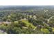 Expansive aerial shot of a home nestled within a lush, green neighborhood and mature trees at 2021 W Front St, Burlington, NC 27215