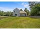 Well-maintained backyard with green grass and a classic wooden fence at 2021 W Front St, Burlington, NC 27215