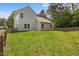 Expansive backyard with lush green grass, enclosed by a wooden fence at 2021 W Front St, Burlington, NC 27215
