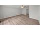 A well-lit bedroom features a ceiling fan and hardwood floors at 2021 W Front St, Burlington, NC 27215