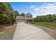 Charming two-story home featuring a brick and siding facade, attached garage, and a well-maintained front yard at 2021 W Front St, Burlington, NC 27215