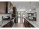 Modern kitchen featuring granite countertops and stainless steel appliances at 2021 W Front St, Burlington, NC 27215