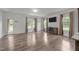 Bright living room with hardwood floors and large windows at 2021 W Front St, Burlington, NC 27215