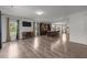 Spacious living room with hardwood floors opening to kitchen at 2021 W Front St, Burlington, NC 27215