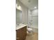 Bathroom with a vanity and a tub-shower combination with white tile surround at 2036 Abbeyhill Dr # 99, Raleigh, NC 27610