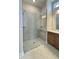 Bathroom featuring a glass shower with a bench, and a vanity with drawers at 2036 Abbeyhill Dr # 99, Raleigh, NC 27610