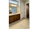 Bright bathroom featuring a vanity with drawers, a mirror and a tile floor at 2036 Abbeyhill Dr # 99, Raleigh, NC 27610