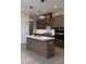 Well-equipped kitchen with a central island, ample counter space, and modern appliances at 2036 Abbeyhill Dr # 99, Raleigh, NC 27610