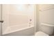Bright bathroom showcasing a soaking tub and updated toilet at 21 Abingdon Farms Dr, Selma, NC 27576