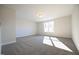 A large bedroom featuring plush carpeting and natural light at 21 Abingdon Farms Dr, Selma, NC 27576