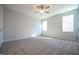 An empty bedroom featuring plush carpeting and natural light at 21 Abingdon Farms Dr, Selma, NC 27576