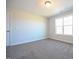 Inviting bedroom with a window, highlighting neutral walls and plush carpeting at 21 Abingdon Farms Dr, Selma, NC 27576