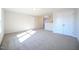 This spacious bonus room offers plush carpeting and lots of natural light at 21 Abingdon Farms Dr, Selma, NC 27576