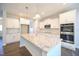 Kitchen island with granite countertops, stainless steel sink, and white cabinets at 21 Abingdon Farms Dr, Selma, NC 27576
