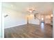 Spacious living room with hardwood floors and ceiling fan with lots of natural light at 21 Abingdon Farms Dr, Selma, NC 27576