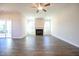 Open-concept living room featuring hardwood floors and a fireplace at 21 Abingdon Farms Dr, Selma, NC 27576