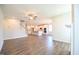 Bright open-concept living room boasts hardwood floors and a seamless flow into the modern kitchen at 21 Abingdon Farms Dr, Selma, NC 27576