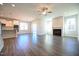 Open-concept living room with hardwood floors and a fireplace at 21 Abingdon Farms Dr, Selma, NC 27576