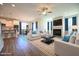 Open-concept living room with hardwood floors, fireplace, and ample natural light at 21 Abingdon Farms Dr, Selma, NC 27576