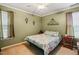 Cozy bedroom with neutral carpet, comfortable bed, and soft lighting at 2116 Sterling Creek Ln, Franklinton, NC 27525
