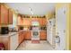 Functional kitchen with wooden cabinets and plenty of counter space at 2116 Sterling Creek Ln, Franklinton, NC 27525